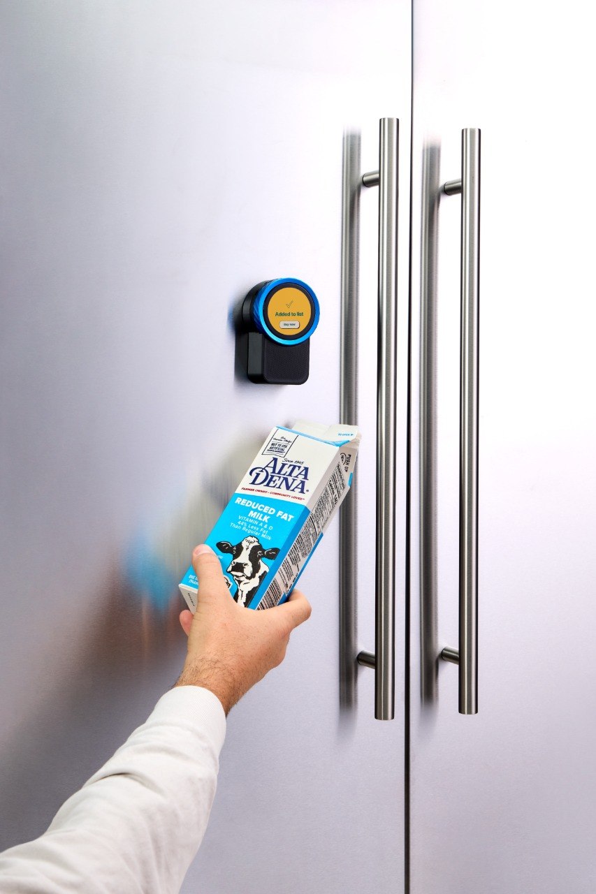 Scanning milk on the Trepo Kitchen Assistant with the device screen visible